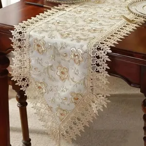 Elegant American style lace table runner with golden floral embroidery for dining table decor.