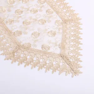 Elegant French lace table runner with floral embroidery for luxury dining table decor.