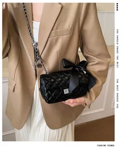 Black quilted chain crossbody bag with bow detail for women fashion luxury style 2026