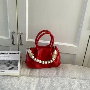 Red pleated cloud handbag for women, stylish short beaded handle fashion purse for daily wear.
