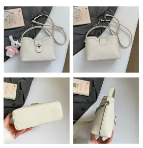 Sac à bandoulière en cuir grainé pour femme, sac seau élégant avec chaîne et poignée.
