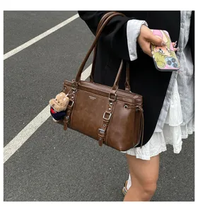 Brown leather shoulder bag for women, large capacity daily tote and commute handbag style.