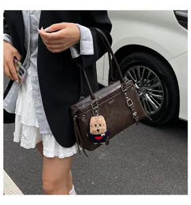 Stylish brown commuter shoulder bag for women, large capacity tote bag with cute dog pendant.