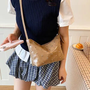Women brown rivet shoulder underarm bag casual stylish crossbody hobo handbag main view display