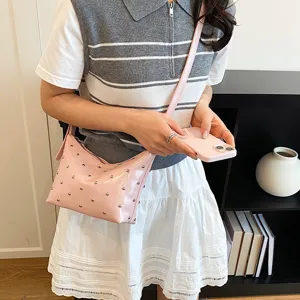 Pink studded shoulder bag for women, trendy underarm hobo bag, casual versatile crossbody purse.