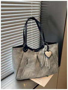 Grey large capacity tote shoulder bag detail showing zipper pocket, dual straps and heart charm.