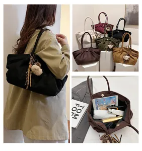 Large capacity corduroy tote bag for women, stylish shoulder bag with cute plush pendant.