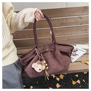 Stylish women's large capacity brown suede tote bag with cute bear pendant for daily commute.