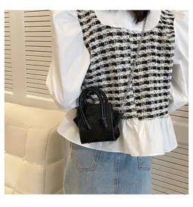 Stylish black mini handbag for women, textured leather crossbody tote bag with chain strap.