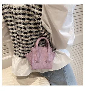 Purple mini top handle crossbody bag with snake pattern, elegant trendy small handbag for women.