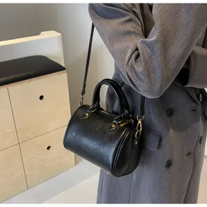 Stylish black Boston handbag for women, minimalist shoulder and crossbody design for daily wear.
