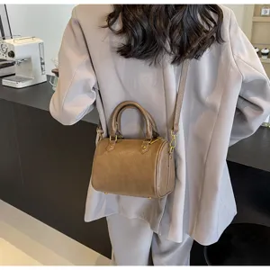 Chic brown Boston shoulder bag for women, trendy PU leather crossbody handbag for daily commute.
