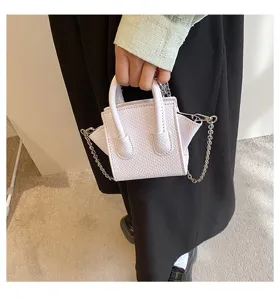Trendy mini fashion handbag with snake pattern texture and metal chain strap for women.
