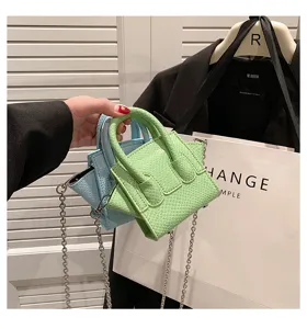 Chic mini snake embossed crossbody bag with top handle and metal chain for women daily style.