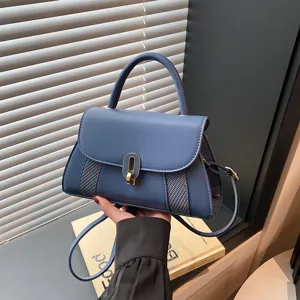 Minimalist blue top-handle square bag, stylish shoulder crossbody bag for women daily use.