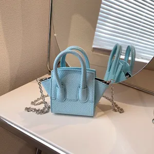 Fashionable light blue mini crossbody bag with chic snake pattern and metal chain strap main view