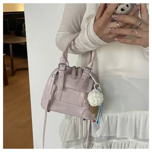 Korean style retro pink PU leather handbag with shoulder strap and cute ice cream keychain detail.