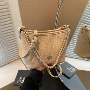 Retrospektive beige Leder Eimer Schultertasche, modische Freizeittasche Umhängetasche.