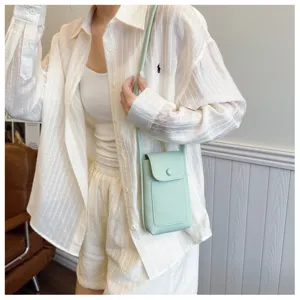 Green soft leather crossbody phone bag for women, stylish mini shoulder bag for daily use.