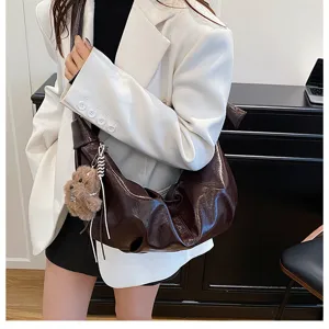 Detailed view of stylish brown hobo shoulder bag, large capacity casual design for women.