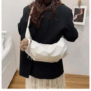 Minimalist solid color large capacity shoulder crossbody dumpling bag detail view.