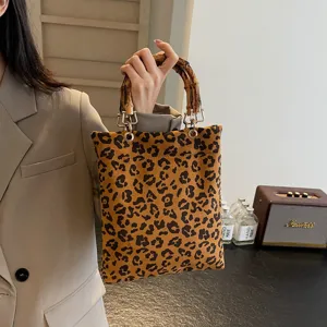 Leopard print handbag with bamboo handle retro chic stylish underarm shoulder bag for women.