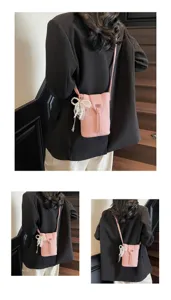 Detailed view of the pink mini crossbody phone bag with cute pearl lace bow decoration.