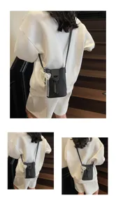 Black mini bucket phone bag for women crossbody style featuring cute pearl ribbon detail.