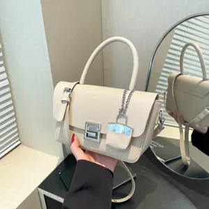 Chic beige woven leather shoulder bag for women, elegant vintage crossbody handbag with metal lock.