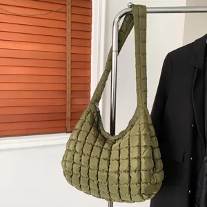 Green quilted puffer shoulder bag, trendy soft cloud dumpling handbag for women daily wear.