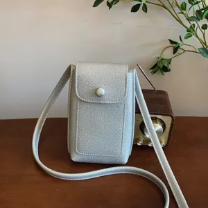 Silver soft leather crossbody phone bag for women, stylish mini shoulder bag main view.