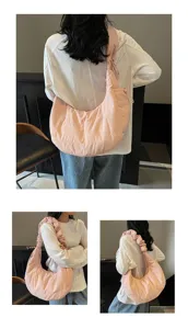 Detail view of the pink casual nylon dumpling shoulder bag showing texture, strap and cloud shape.