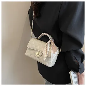 Quilted chain shoulder bag for women, elegant white crossbody bag with scarf detail and metal strap.
