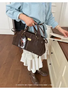 Classic vintage brown Boston bag for women, large capacity stylish shoulder handbag.