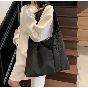Large capacity black quilted shoulder bag, casual tote detail view, daily commute style.