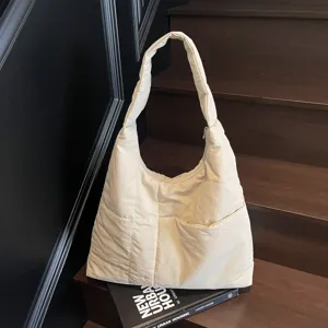 Oversized quilted shoulder bag in beige, casual hobo bag main view showcasing soft padded style.