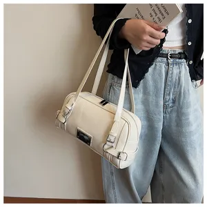 Stylish women's cream white bowling shoulder bag, trendy niche design underarm tote purse.