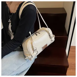 Stylish cream white bowling shoulder bag with metal buckle details for women, chic accessory.
