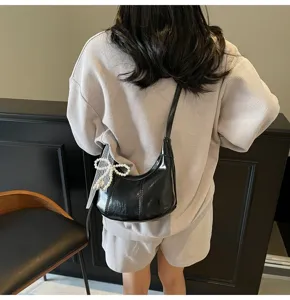 Black glossy shoulder bag women pearl bow retro crossbody dumpling casual purse.