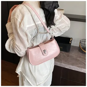 Pink patent leather shoulder bag, trendy underarm bag with metal lock for women daily commute.