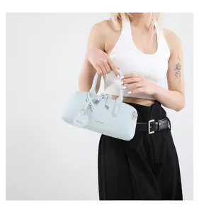 Light blue cylindrical Boston handbag for women, chic PU leather top handle shoulder bag.