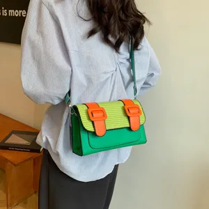 Stylish color-block satchel bag for women, trendy single-shoulder crossbody handbag.