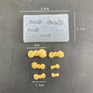 Mini twisted cruller silicone mold detail shot showing mold cavities and clay pieces with size.