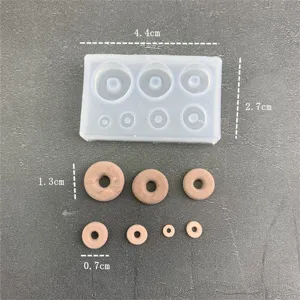 Miniature donut silicone mold detail showing precise dimensions and tiny clay model pieces.