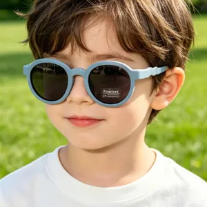Kids polarized sunglasses with cute round light blue frames for outdoor sun protection.