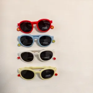 Close up details of colorful kids sunglasses frame and polarized lens in multi colors.
