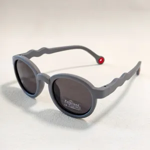 Grey round kids polarized sunglasses detail with UV400 protection lens and wavy temples.