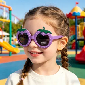 Close-up detail of cute purple strawberry polarized sunglasses worn by a child outdoors.