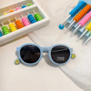 Kids polarized round frame sunglasses in light blue candy color, UV400 protection summer outdoor.