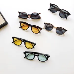 Kids sunglasses detail shot, fashion vintage rivet frame children sun glasses UV400 protection.